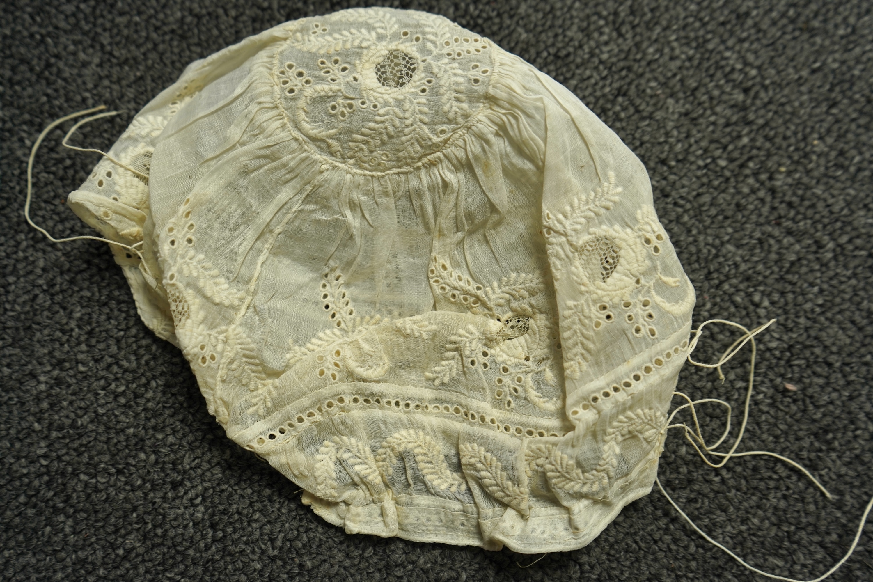 A collection of six baby’s bonnets from the mid 18th century to the late 19th century. An 18th century Hollie Point inserted baby bonnet, a quilted 18th century baby bonnet, two white work bonnets with needle lace crown